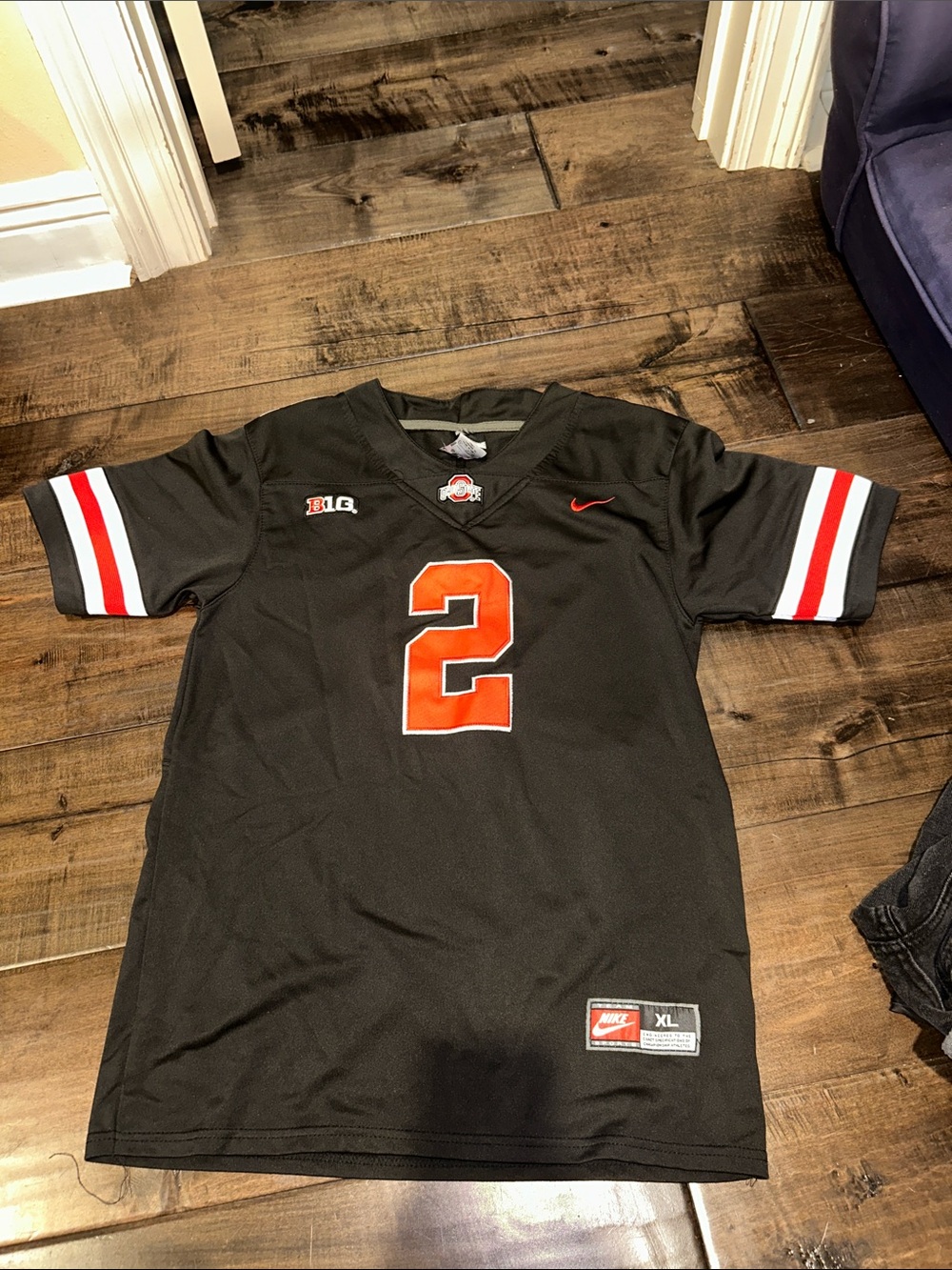 Olave Nike Black & Orange Football Jersey with Red & White Sleeve Stripes